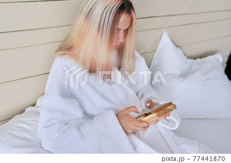 Young woman with kalimba musical instrument, play thumb piano 77441870