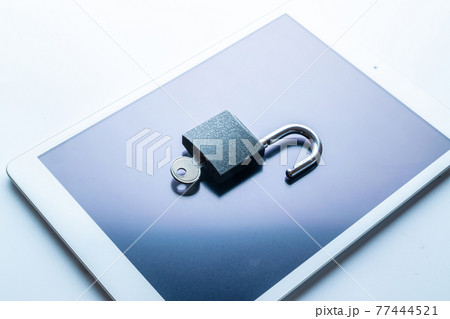 Networking security protection. Modern space grey mobile phone with padlock, key on white background. Smartphone fraud, online scam and cyber security threat. 77444521