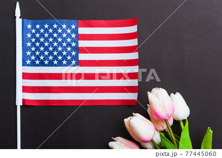 Happy Memorial Day, American flag and a Tulip flower Happy Memorial Day, American flag and a Tulip flower 77445060