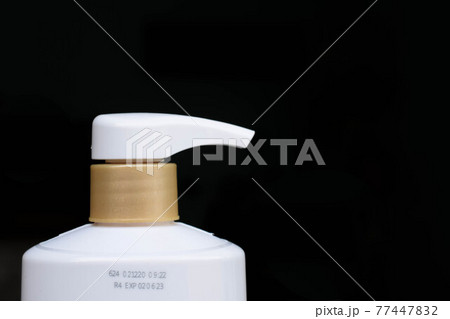 Manufacturing date and expiry date on bottle surface 77447832
