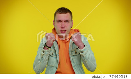 Upset frustrated annoyed irritated man quarreling, asking reason of conflict, why such stubborn 77449513