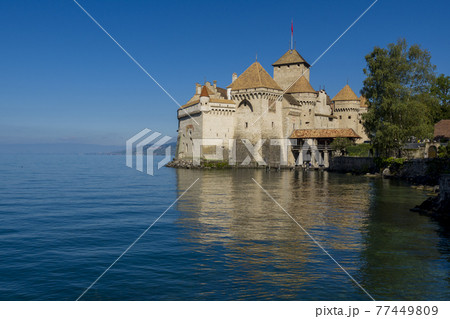 panoramic view of historic Chateau de Chillon at Lake Geneva in summer, Canton of Vaud, Switzerland 77449809