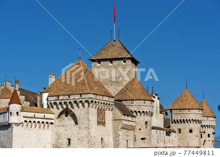 panoramic view of historic Chateau de Chillon at Lake Geneva in summer, Canton of Vaud, Switzerland 77449811