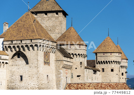 panoramic view of historic Chateau de Chillon at Lake Geneva in summer, Canton of Vaud, Switzerland 77449812