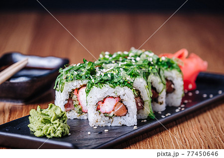 Sushi on a Wooden Table in Restaurant, Delicious Japanese Food, Sushi Rolls 77450646