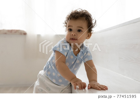 Cute little African American baby child play at home Cute little African American baby child play at home 77451595