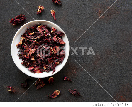 Hibiscus tea in white bowl. Slate background. Copy space. 77452133