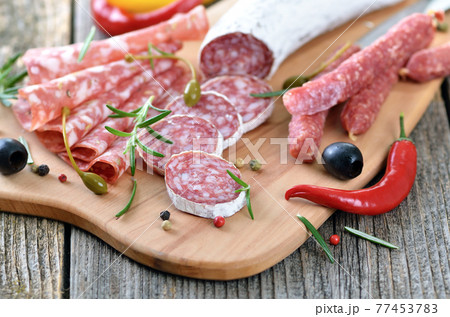 Snack with delicious French and Italian salami, spiced with rosemary and pepper Snack with delicious French and Italian salami, spiced with rosemary and pepper 77453783
