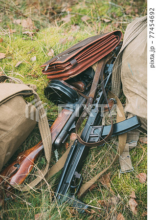 Old Soviet Russian Red Army Submachine Gun PPS-43 Of World War II Lying In Grass. Old Soviet Russian Red Army Submachine Gun PPS-43 Of World War II Lying In Grass. 77454692