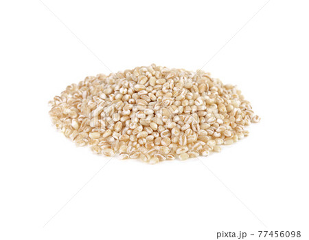 pile of pearl barley isolated on white background. 77456098
