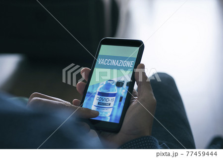 man and text vaccination in italian in smartphone man and text vaccination in italian in smartphone 77459444