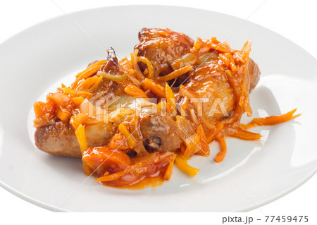 stewed chicken with carrots and onions on a plate, white background stewed chicken with carrots and onions on a plate, white background 77459475