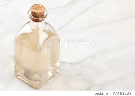 A photo of a corked bottle of homemade rosewater face toner 77461228