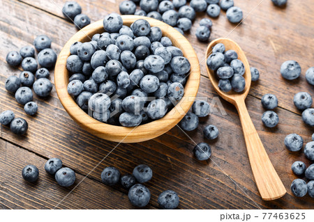 Juicy and fresh blueberries on a rustic table. Vegan and vegetarian concept. 77463625