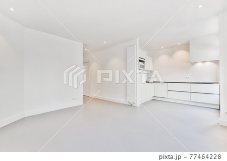 Spacious room with open kitchen furniture Spacious room with open kitchen furniture 77464228
