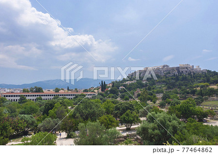 View of the Acropolis of Athens and Stoa of Attalos building with ancient greek ruins, famous tourist attraction in Greece, in sunny summer day View of the Acropolis of Athens and Stoa of Attalos building with ancient greek ruins, famous tourist attraction in Greece, in sunny summer day 77464862