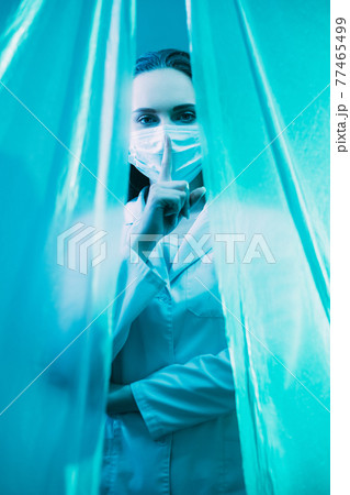 medical privacy keep quiet doctor hush gesture 77465499