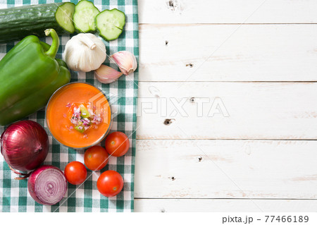 Gazpacho soup in glass on wooden table Gazpacho soup in glass on wooden table 77466189