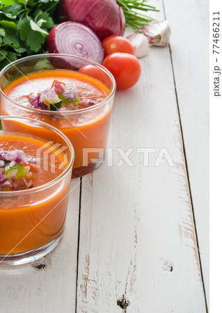 Gazpacho soup in glass on wooden table 77466211
