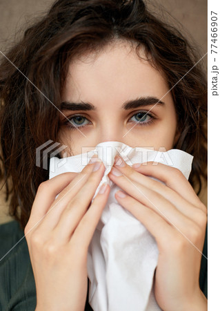 sick girl having influenza symptoms coughing at home sick girl having influenza symptoms coughing at home 77466907