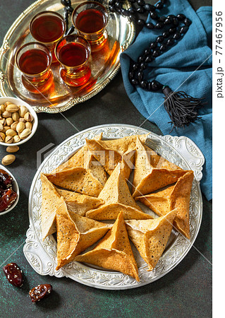 Arabic Cuisine. Ramadan Kareem Festive. Ramadan menu, arabian pancake katayef (katayev, qatayef) and dates, pistachio. 77467956