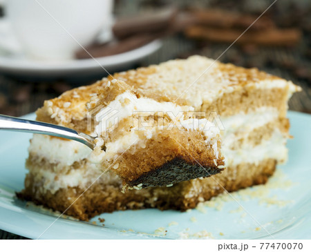 delicious cake cut into pieces 77470070