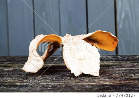 citrus peel on an old wooden table citrus peel on an old wooden table 77470127