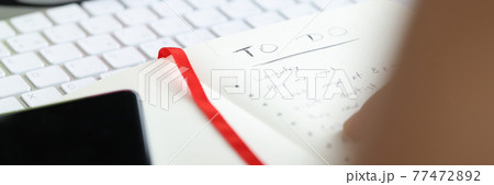 On table is diary with to-do list. On table is diary with to-do list. 77472892