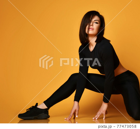 Young sexy pretty lady in black sportswear 77473058