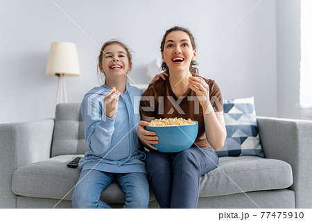 family watching TV family watching TV 77475910