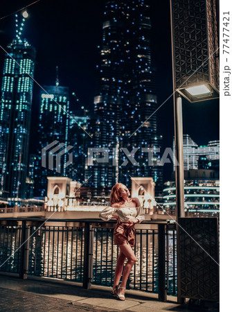 Sensual slim woman tourist in summer clothes with Sensual slim woman tourist in summer clothes with 77477421