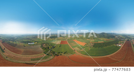 360 panorama by 180 degrees angle seamless panorama of aerial view of fresh grass, rice and crops field with green mountain hill in agriculture. Nature landscape background in Thailand. harvest 360 panorama by 180 degrees angle seamless panorama of aerial view of fresh grass, rice and crops field with green mountain hill in agriculture. Nature landscape background in Thailand. harvest 77477683