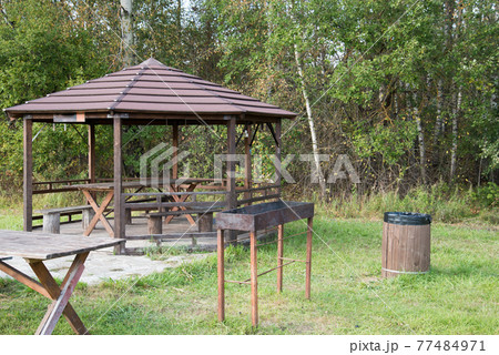 A place for barbecue and outdoor recreation. Table and benches under a canopy in the bosom of nature. Fresh air and calm. 77484971