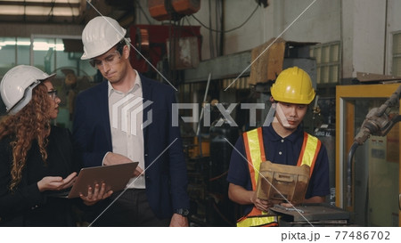 business engineering in hardhats discuss information on laptop computer business engineering in hardhats discuss information on laptop computer 77486702