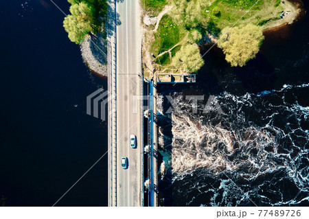 Car moving on bridge in europe small town, aerial view Car moving on bridge in europe small town, aerial view 77489726