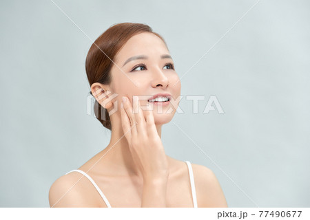 Cleansing young woman on blue background Cleansing young woman on blue background 77490677