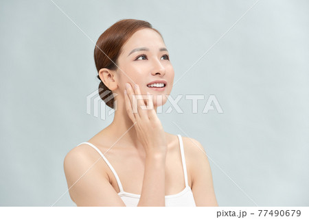 beauty skin care woman on light blue beauty skin care woman on light blue 77490679