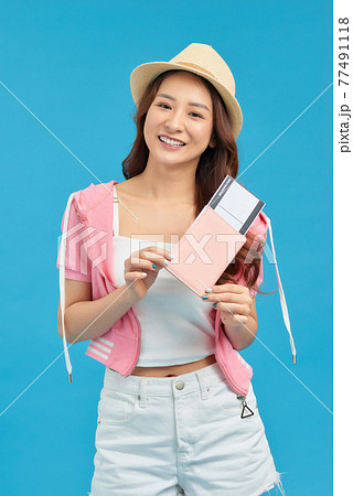 Happy woman holding passport isolated portrait of smiling girl. Happy woman holding passport isolated portrait of smiling girl. 77491118