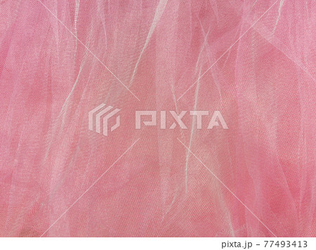 Pink tulle fabric texture top view. Coral background. Fashion rose color trendy feminine tutu skirt flat lay,female blog Pink tulle fabric texture top view. Coral background. Fashion rose color trendy feminine tutu skirt flat lay,female blog 77493413