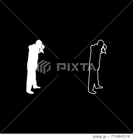 Man is blow one's nose into handkerchief tissue  77494574