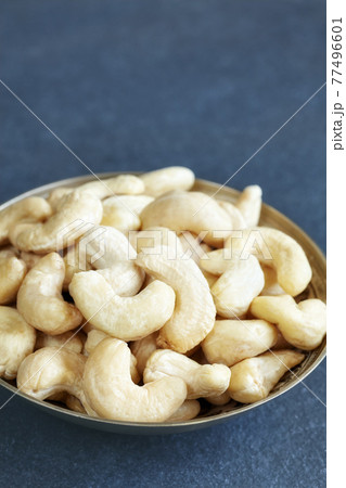 Cashew nuts in a bowl, selective focus, space for text. Cashew nuts in a bowl, selective focus, space for text. 77496601