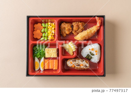 (inari sushi) sushi rice wrapped in dried tofu with fried shrimp and fried chicken in bento set (inari sushi) sushi rice wrapped in dried tofu with fried shrimp and fried chicken in bento set 77497317