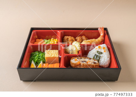 (inari sushi) sushi rice wrapped in dried tofu with fried shrimp and fried chicken in bento set (inari sushi) sushi rice wrapped in dried tofu with fried shrimp and fried chicken in bento set 77497333