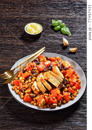 Salad of chickpea, butternut on a plate, top view 77497435