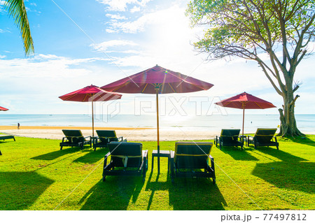 umbrella and beach chair with sea beach background and blue sky 77497812