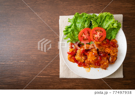 Fried fish topped with 3 flavors chili sauce Fried fish topped with 3 flavors chili sauce 77497938