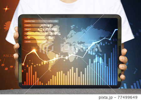 Close-up Of Business man's hand holding tablet showing stock market statistics gain profits and increase of chart positive indicators. Financial analysis, statistics. Concept of business strategy. 77499649
