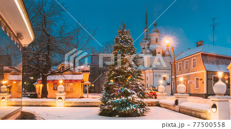 Parnu, Estonia. Christmas Tree In Holiday New Year Festive Illumination And St. Katherine Orthodox Church On Background Parnu, Estonia. Christmas Tree In Holiday New Year Festive Illumination And St. Katherine Orthodox Church On Background 77500558