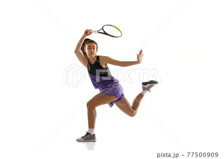 Young caucasian woman playing tennis isolated on white studio background in action and motion, sport concept 77500909