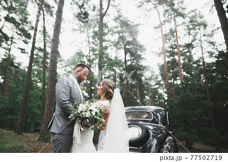 Caucasian happy romantic young couple celebrating their marriage. Outdoor Caucasian happy romantic young couple celebrating their marriage. Outdoor 77502719